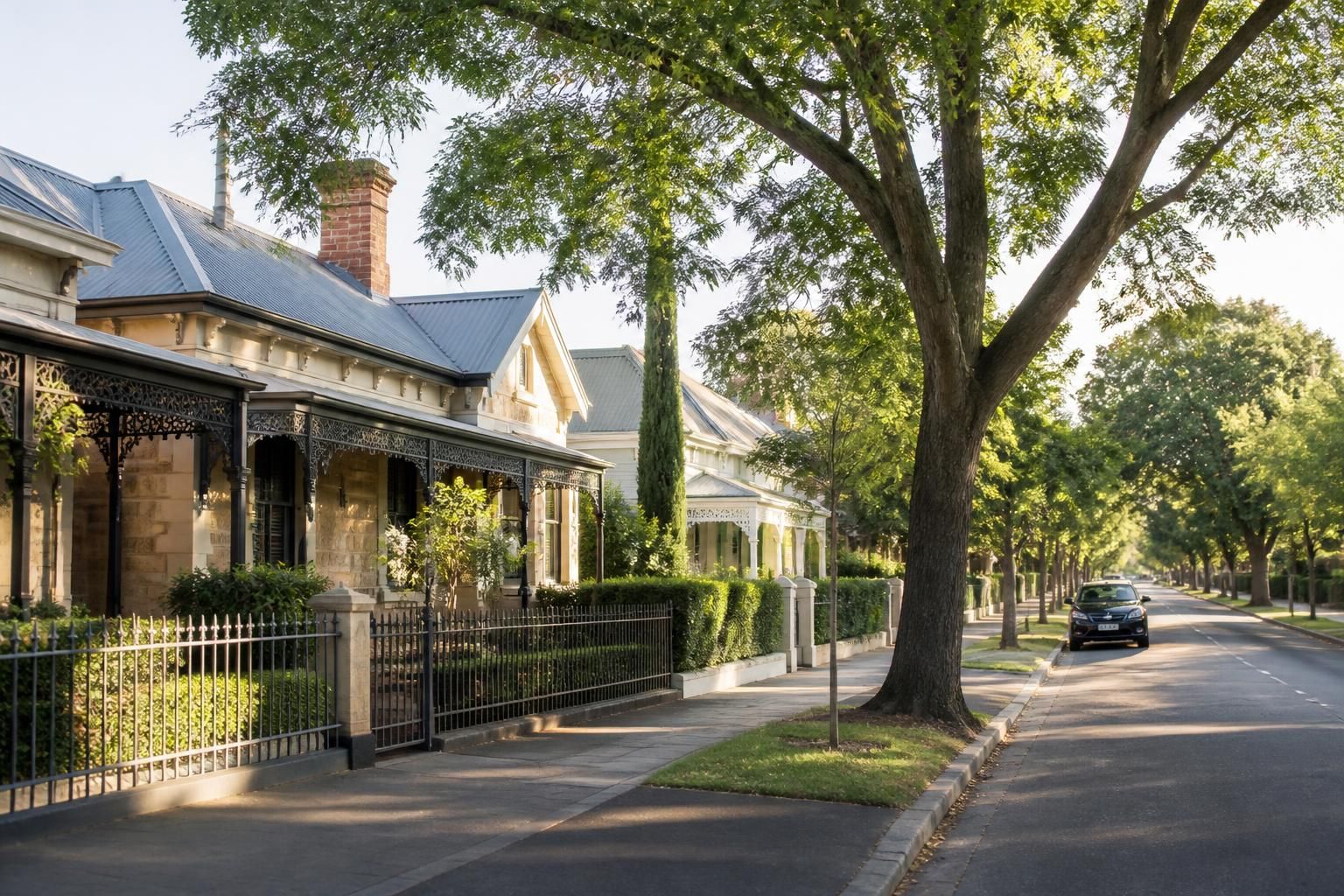 Adelaide neighborhood street with heritage homes and soft light.